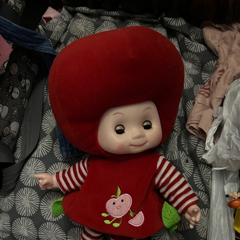 Red Stuffed Doll with Apple Design. Vintage doll. She talks and she works good.